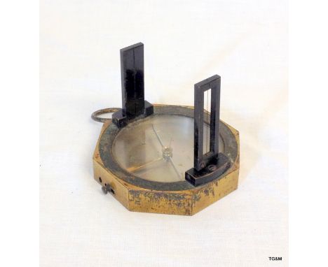 A Victorian brass mounted hand held sighting compass of octagonal form 7 cms diameter