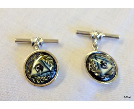 A pair of silver and enamel set Masonic cufflinks
