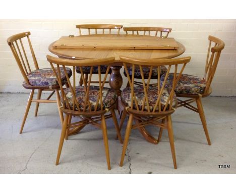 An Ercol Blonde extending table and 6 chairs 75 x 110 x 98 leaf 75 x 38