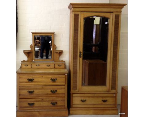 A mirrored single wardrobe with 1 drawer and a 3 over 3 drawer mirrored dressing table all in light oak