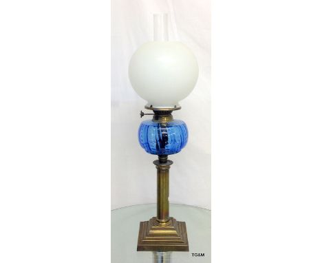 A brass based Victorian single burner oil lamp with Flue and lamp 67 x 15 on the base  x 19 on the ball