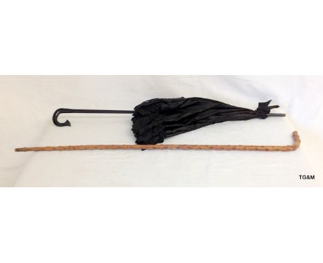 A brussell sprout cane walking stick  and a black parasol