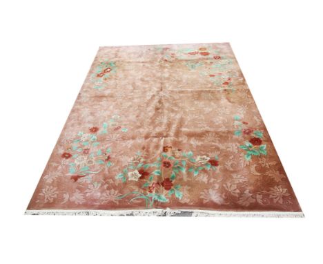 Chinese carpet with scrolling foliage and blossoming flowers on a brown ground, 365 x 272cm