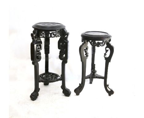 Two Chinese ebonised jardiniere stands, with scroll carved frieze and legs joined by undershelf with paw feet, H85 Diameter 3