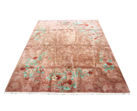 Chinese carpet with scrolling foliage and blossoming flowers on a brown ground, 365 x 272cm
