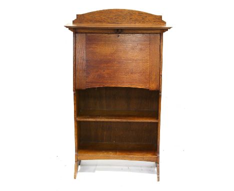 Arts and Crafts style oak bureau, the bow front shelf over a fall front enclosing pigeon holes above two shelves on bracket f