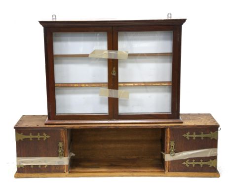 Mahogany wall hanging display cabinet, with moulded cornice above two glazed doors, with indistinct plaque to top, H61 W82.5 