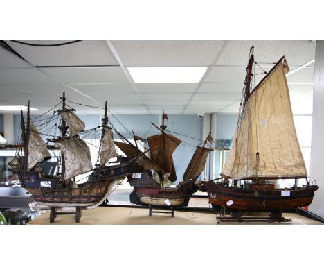Three wooden model boats to include a galleon, h50cm w57cm (with stand), a sailing boat, h74cm w50cm (with stand), and a gall