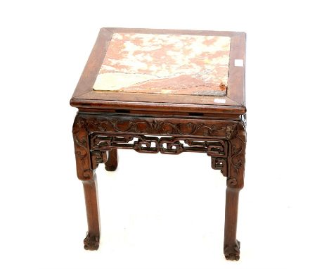 Chinese carved hardwood occasional table, with red marble inset top (cracked) above a square scroll carved frieze on square l