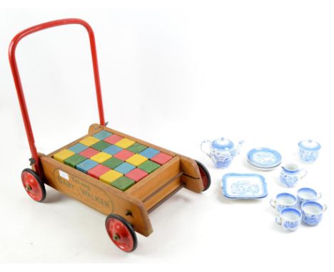 Triang Baby Walker, with wooden bricks, height 50cm. With blue and white ceramic child's tea service, height typically 5cm.  