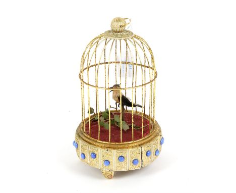 Birdcage automaton in gilt and white cage with bird on perch, H23cm