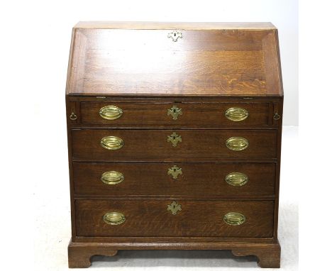 19th century oak bureau, the fall front revealing a fitted interior, above four long graduated drawers on bracket feet, H105 