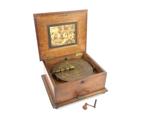 Victorian walnut and inlaid table top polyphon, the cover inlaid having a panel with flowers, the inside of the cover with pr