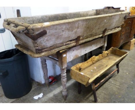 A pine table with end drawer, together with a trough on raised metal supports and a larger trough (3)
