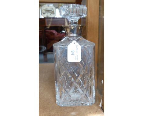 A silver mounted cut-glass decanter, Birmingham 1974 of square form with plain silver neck, height 24cm