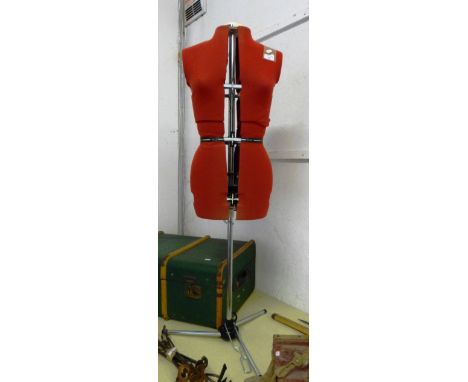 A dressmaker's mannequin on chrome stand
