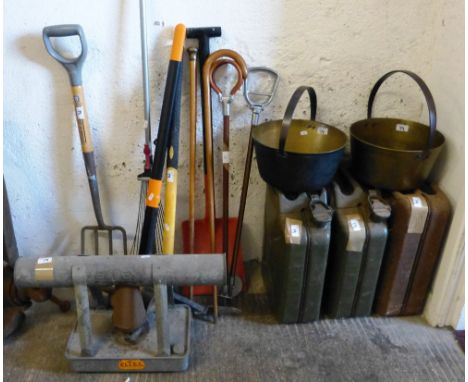 Three jerry cans, two brass jam pans, two shooting sticks, two walking canes, garden tools, a galvanised greenhouse heater an