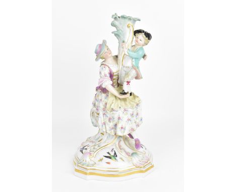 A late 19th century Meissen porcelain lighting base, top part missing, modelled as a mother and child standing on her lap whi