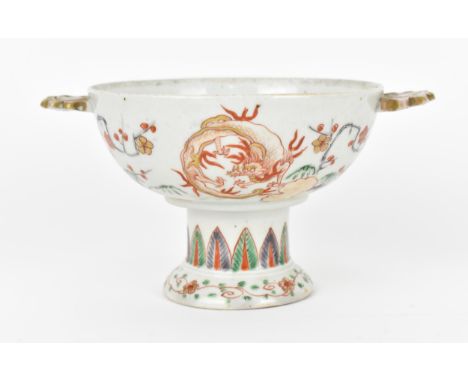 A Chinese Qing dynasty Famille Verte porcelain stem cup, 18th century, probably Kangxi period (1661-1722), the bowl with twin