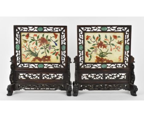 A pair of Chinese jade and hardstone table screens, early 20th century, each with central rectangular pale jade panel inset w