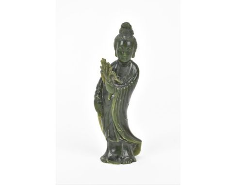 A Chinese Qing dynasty spinach Jade figure of the deity Guanyin in traditional draped clothing, 16.5 cm high