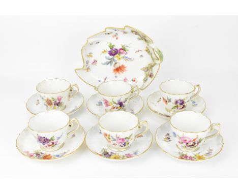 An early 20th century Meissen porcelain set of teacups and saucers, comprising a set of 6, together with a biscuit plate in t