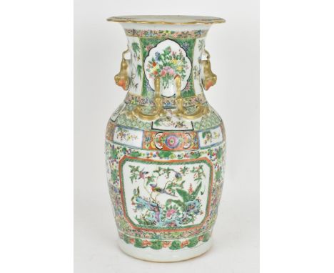 A Chinese Export Famille Rose porcelain baluster vase, Canton, Late 19th/early 20th century, decorated with enamel cartouches