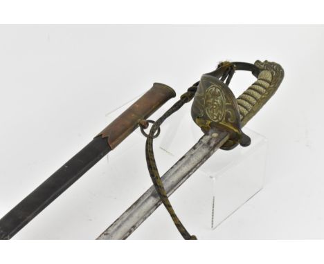 An 1827 pattern Royal Navy Officers sword and scabbard having lion head pommel and folding guard, with knot 