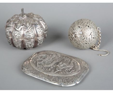A CHINESE WHITE METAL VANITY CASE 20th century, the hinged lid decorated in relief with a dragon chasing pearls and opening t