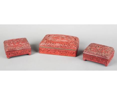 A GROUP OF THREE CHINESE CINNABAR LACQUER BOXES20th century, the largest decorated with figures in a mountainous landscape, 1