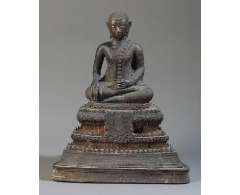 A THAI BRONZE BUDDHA Rattankosin Kingdom, 18th/19th century, modelled seated in Dhyanasana on an elaborately decorated four t