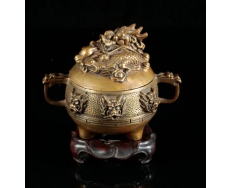 A CHINESE GILT BRONZE CENSERbearing a four character Xuande mark to the base, Qing dynasty, the lid cast with a coiled dragon