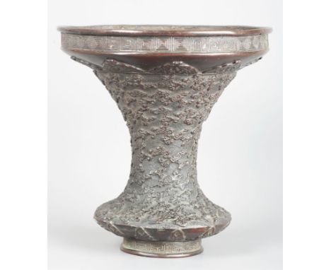 A JAPANESE BRONZE FLOWER VASEMeiji period, of archaistic Gu form, decorated throughout with clouds in relief and geometric ba
