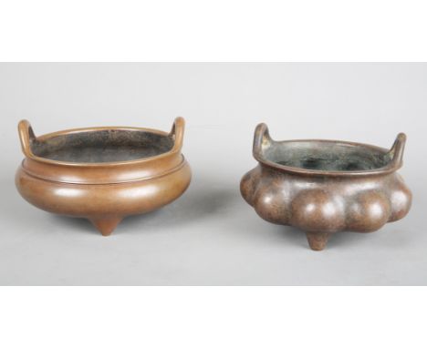 A CHINESE BRONZE TRIPOD CENSERbearing an apocryphal Xuande seal mark to the base, of circular section with two ring handles, 