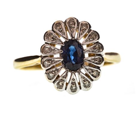 ART DECO STYLE DIAMOND AND GEM SET RING, set with a central oval faceted blue gem with a diamond set border, in nine carat go