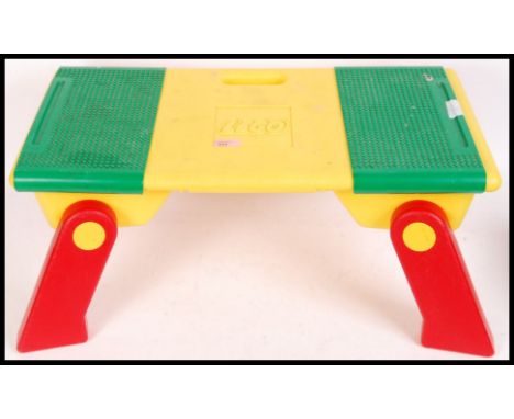 An original vintage Lego assembly &amp; storage table with 2x slide along base plates tops with a quantity of loose Lego to i