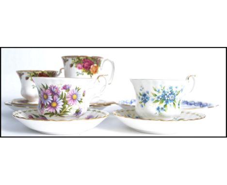 A Royal Albert Old Country Roses tennis set together with Royal Albert cup and saucers in Forget Me Not and Michaelmas Daisy 