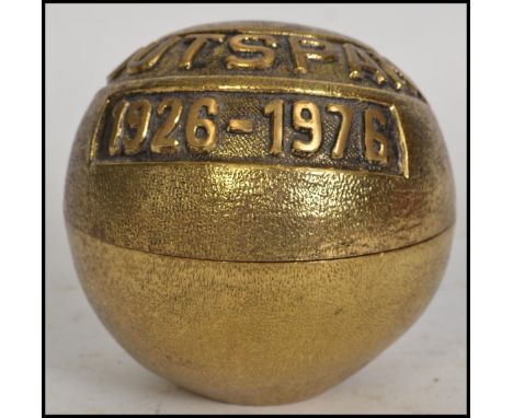 An unusual gilt brass Outspan 1926 - 1976 caddy in the form of an orange with notation atop, splitting to center. 10cms high&