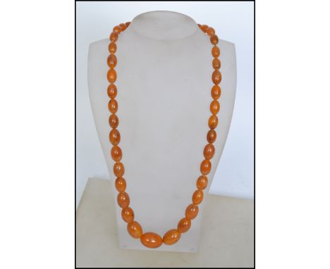 A vintage 20th century &nbsp;amberite beaded necklace with a string of graduated butterscotch amberite beads,&nbsp;