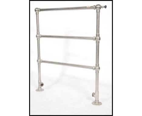Architectural Salvage. An early 20th century towel radiator. Of tubular form with floor brackets and twin rails. Measures 93c