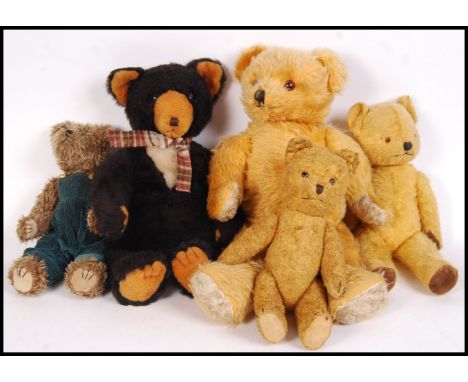 A collection of 5x 20th century vintage stuffed teddy bears to include; bear in dungarees, 3x golden mohair coloured bears &a