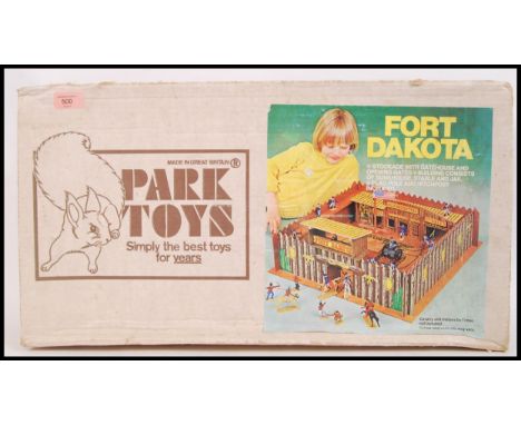 An original vintage Park Toys Fort Dakota Wild West wooden fort play set. Appears complete. Within its original box.&nbsp;