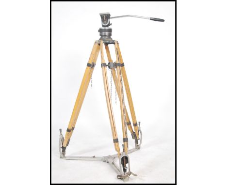 A good mid century tv / film cinema wooden camera tripod stand complete with the metal bracket base being marked for UPITN Ca