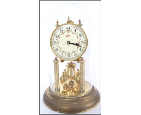 A vintage 20th century German glass domed brass perpetual / anniversary clock.