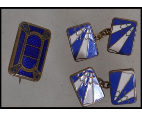 A pair of early 20th century Art Deco gentleman's cuff links in blue and white enamel having the famous Rising Sun design alo