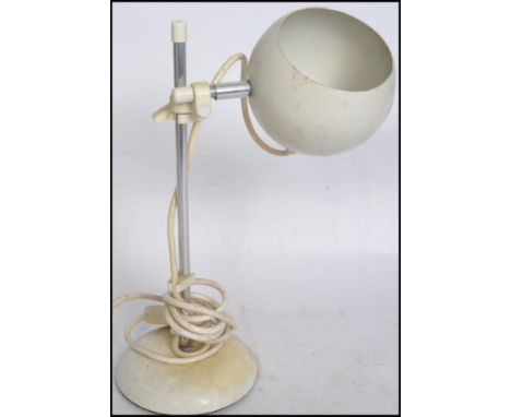 A vintage 20th century retro sputnik atomic Eyeball desk lamp in the manner of&nbsp;Gino Sarfatti for Arteluce raised on a ci
