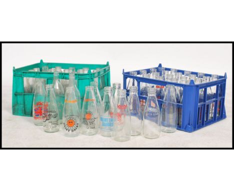 A collection of vintage and retro advertising and plain milk bottles for Dunsford dairies dating from the 1960's within origi