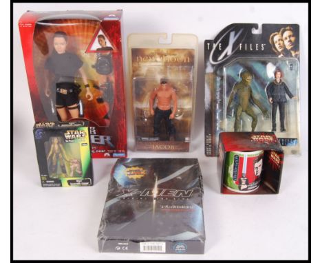 A collection of original contemporary film related toys to include; Playmates Lara Croft Tomb Raider action figure, X-Men Tra