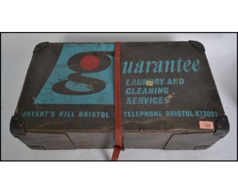 A vintage / retro 20th century dry cleaning laundry case with notation to the front for Guarantee Laundry Services.&nbsp;Meas