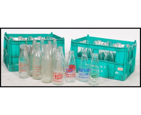 A collection of vintage and retro advertising and plain milk bottles for Dunsford dairies dating from the 1960's within origi